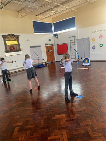 Children taking part in archery