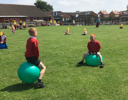 Children on space hoppers