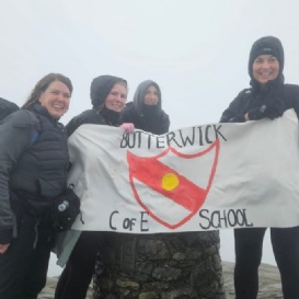 4 of our school staff at the top of Mount Snowdon